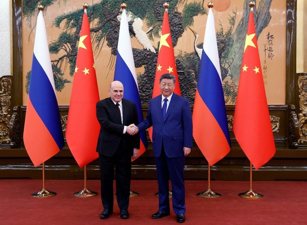 China, Russia vow joint response to 'unilateral' sanctions during Russian PM visit | Reuters China, Russia vow joint response to 'unilateral' sanctions during Russian PM visit | Reuters